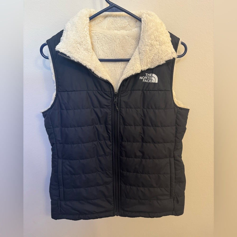 The North Face reversible Navy Blue and Cream Fleece Vest.